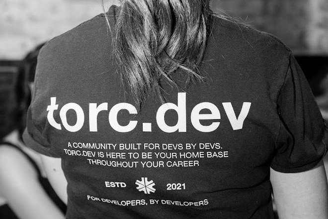 back of a torc.dev shirt: a community built for devs by devs